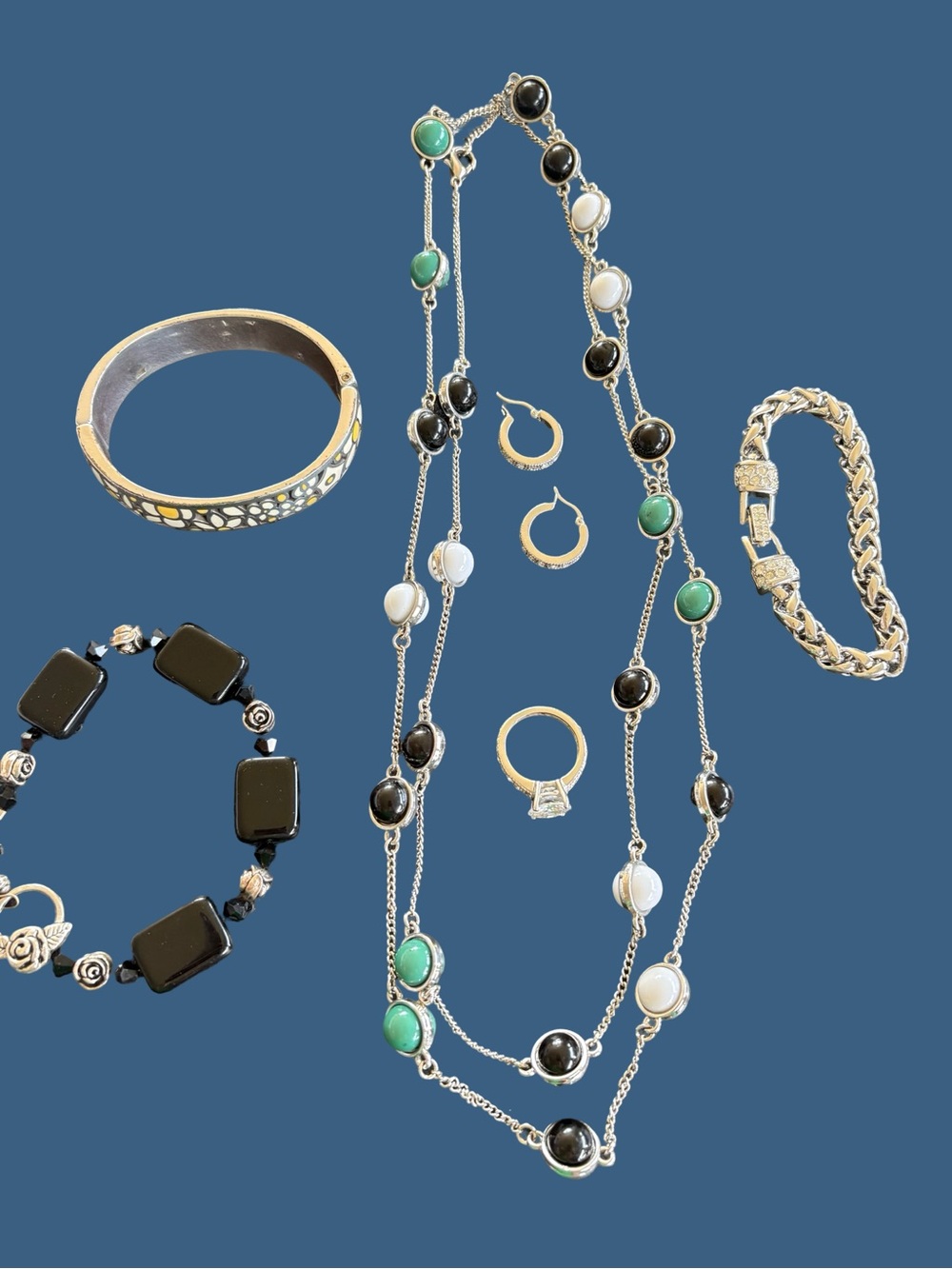 Black, green and silvertone jewelry set.